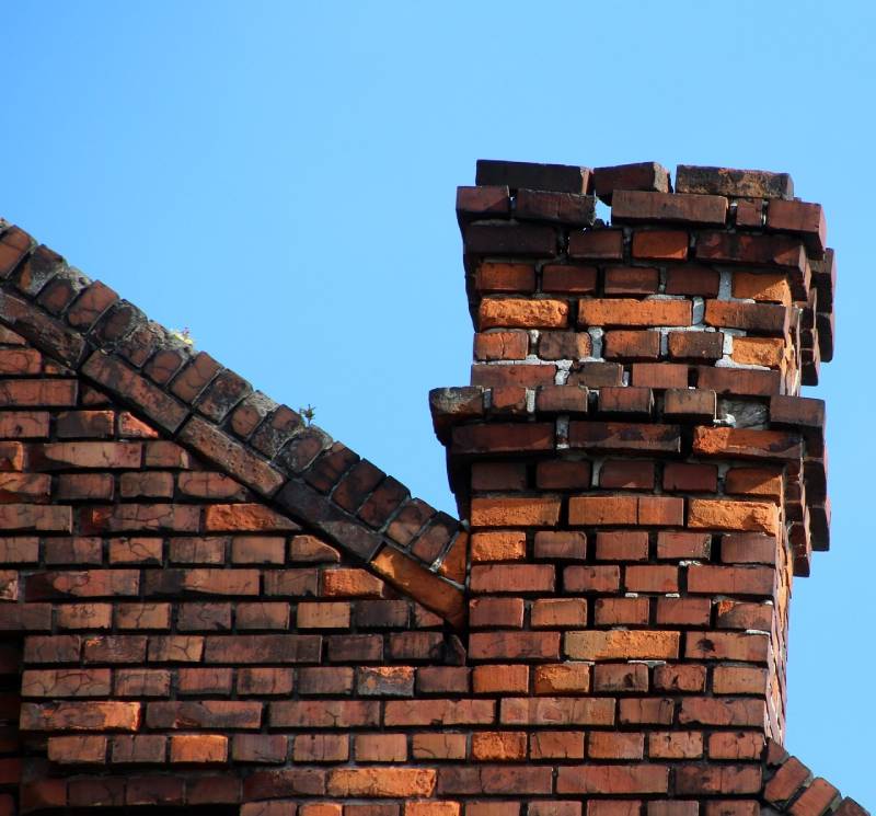 Signs Your Allenton Home Needs a Chimney Inspection Damaged chimney on an Allenton home showing cracks and missing mortar